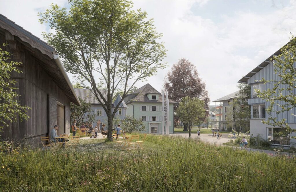 Visualisierung „Blick vom Eingang in das Areal – Terrasse vor der Scheune, Glockenturm und Park
